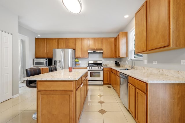 755 Rockhurst Rd, Bolingbrook, IL 60440 - kitchen with stainless steel appliances, under cabinet range hood, light tile patterned floors, light stone countertops, and recessed lighting