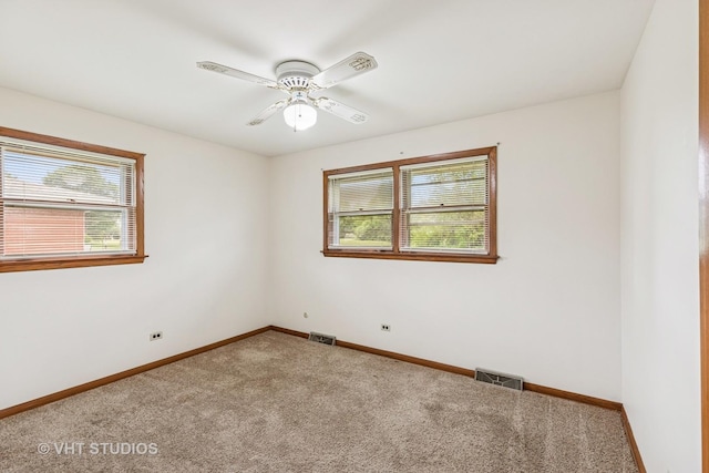 452 Miller St, Beecher, IL 60401 - unfurnished room featuring carpet flooring, baseboards, and a ceiling fan