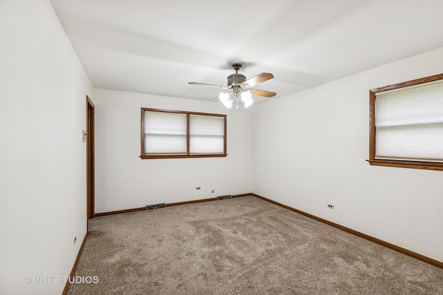 452 Miller St, Beecher, IL 60401 - carpeted empty room with plenty of natural light, a ceiling fan, and baseboards