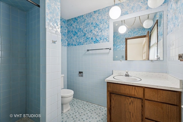 452 Miller St, Beecher, IL 60401 - full bathroom featuring wallpapered walls, vanity, a tile shower, wainscoting, and toilet