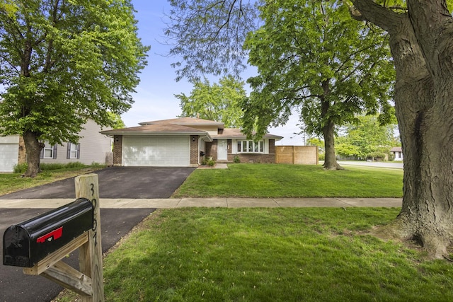 3907 New Haven Ave, Arlington Heights, IL 60004 - view of front of property featuring driveway, brick siding, and a garage