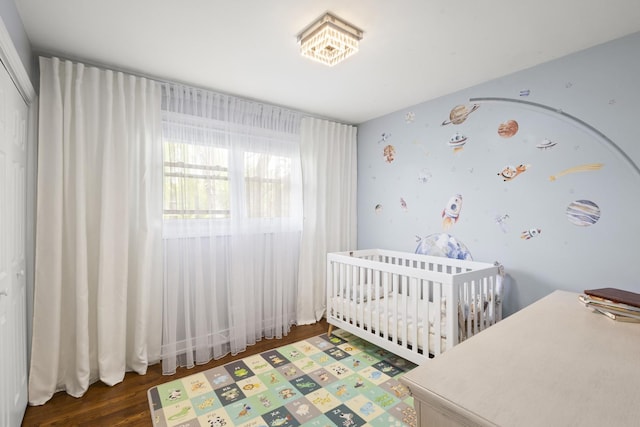 3907 New Haven Ave, Arlington Heights, IL 60004 - bedroom featuring wood finished floors, a closet, and a nursery area