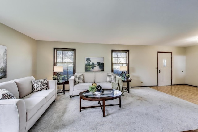 1976 Monday Dr, Elgin, IL 60123 - living area with healthy amount of natural light, light colored carpet, and baseboards