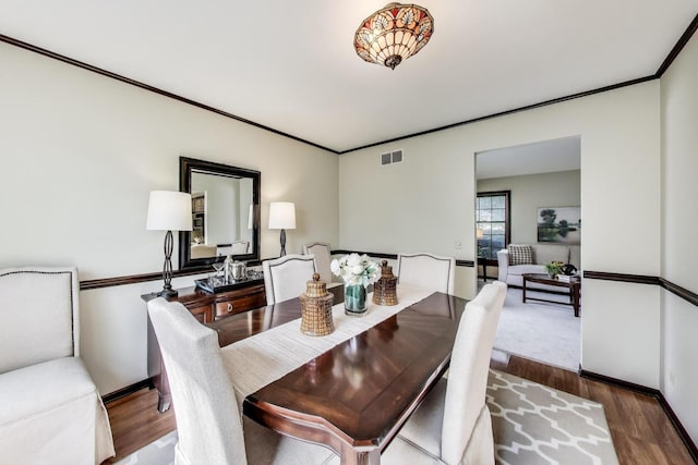 1976 Monday Dr, Elgin, IL 60123 - dining area featuring wood finished floors, baseboards, and ornamental molding