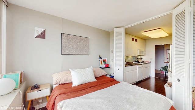 bedroom featuring dark wood-style floors
