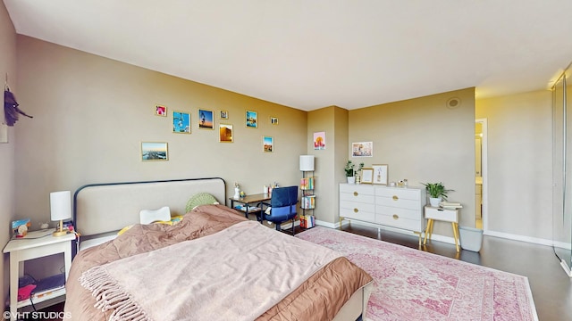 bedroom featuring baseboards