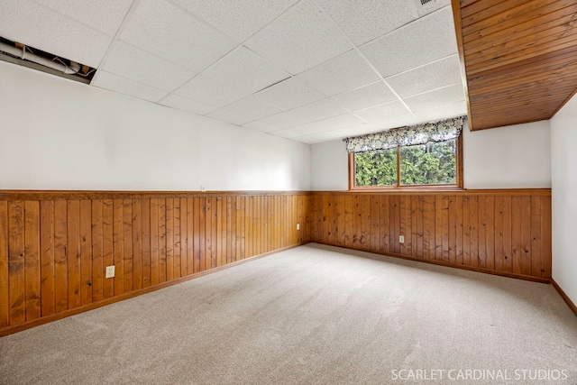 6N510 Sycamore Ave, Saint Charles, IL 60174 - empty room featuring a wainscoted wall, a drop ceiling, baseboards, carpet, and wood walls