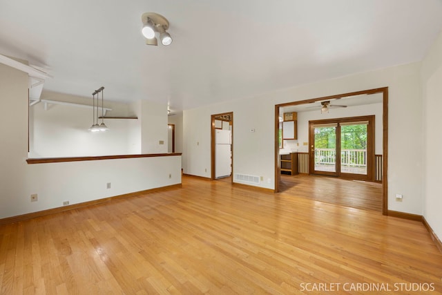 6N510 Sycamore Ave, Saint Charles, IL 60174 - unfurnished living room with light wood-type flooring, baseboards, and ceiling fan