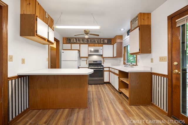 6N510 Sycamore Ave, Saint Charles, IL 60174 - kitchen featuring white appliances, a peninsula, a ceiling fan, light countertops, and a sink