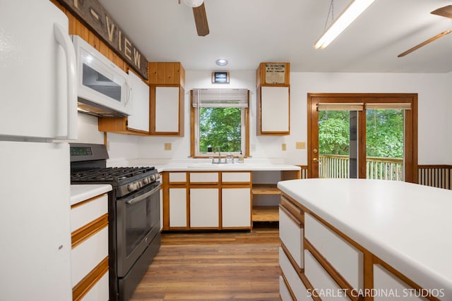 6N510 Sycamore Ave, Saint Charles, IL 60174 - kitchen with white appliances, ceiling fan, a sink, light countertops, and wood finished floors
