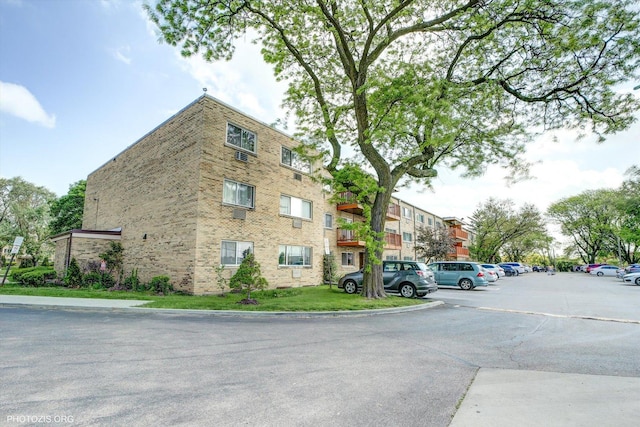 view of property with uncovered parking