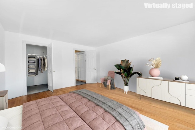bedroom with wood finished floors