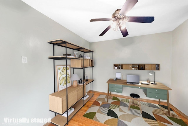 office space featuring wood finished floors, baseboards, and ceiling fan