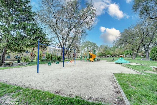 community jungle gym featuring a yard