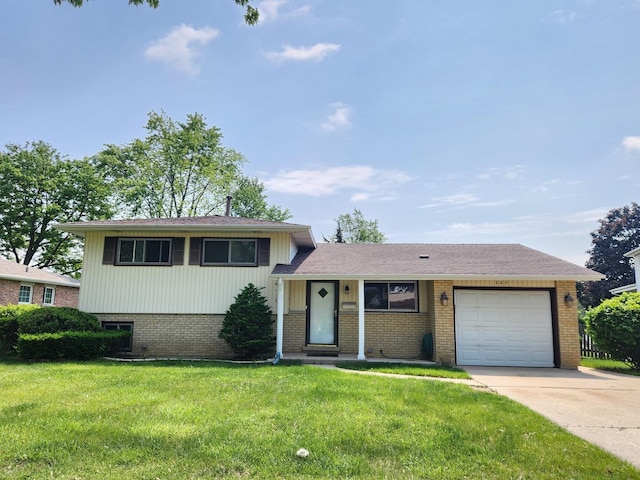 237 Sumac Ln, Schaumburg, IL 60193 - tri-level home featuring brick siding, a garage, a front lawn, and driveway