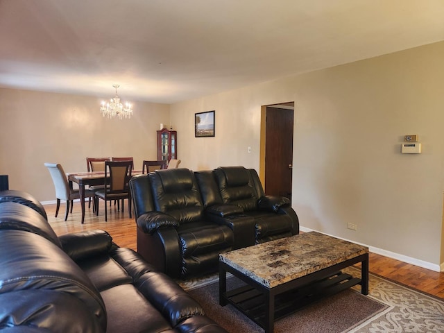 237 Sumac Ln, Schaumburg, IL 60193 - living area with a chandelier, wood finished floors, and baseboards