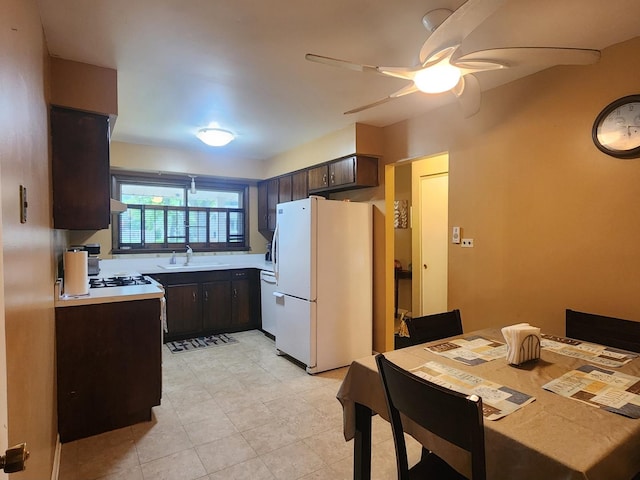 237 Sumac Ln, Schaumburg, IL 60193 - kitchen with freestanding refrigerator, a sink, dark brown cabinets, light countertops, and ceiling fan