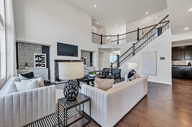 1995 Norwich Ln, Bolingbrook, IL 60490 - living area featuring dark wood-type flooring, recessed lighting, a towering ceiling, stairway, and baseboards