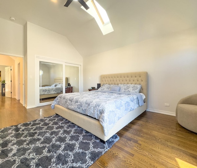 8024 N Odell Ave, Niles, IL 60714 - bedroom featuring lofted ceiling, a skylight, wood finished floors, a closet, and baseboards