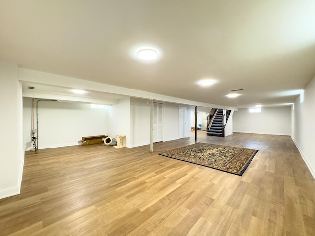 8024 N Odell Ave, Niles, IL 60714 - basement featuring stairs, wood finished floors, and baseboards