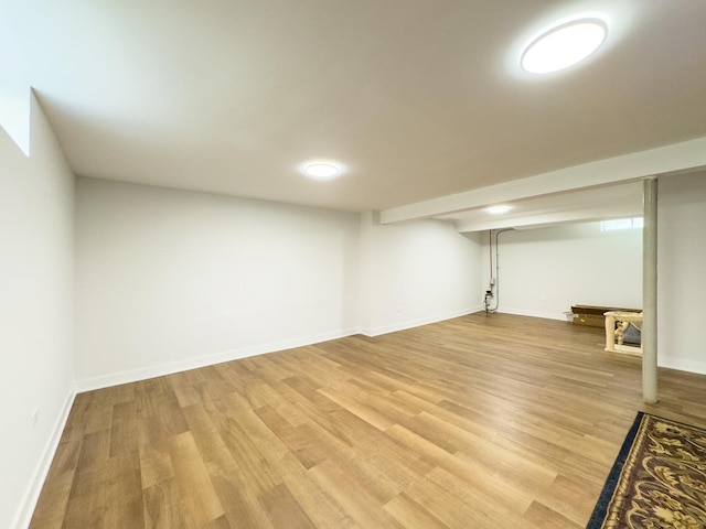 8024 N Odell Ave, Niles, IL 60714 - finished basement with light wood-style floors and baseboards