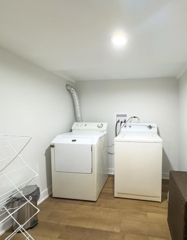 8024 N Odell Ave, Niles, IL 60714 - laundry room featuring washing machine and clothes dryer, light wood finished floors, and baseboards