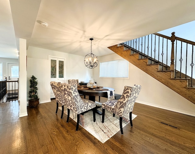 8024 N Odell Ave, Niles, IL 60714 - dining room with wood finished floors, baseboards, stairs, and a chandelier