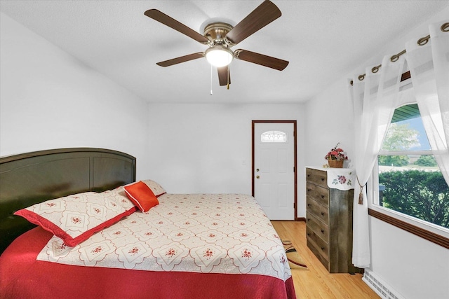 2908 Rolling Acres Dr, Champaign, IL 61822 - bedroom featuring light wood-type flooring and a ceiling fan