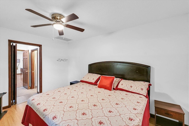 2908 Rolling Acres Dr, Champaign, IL 61822 - bedroom with light wood-style floors and ceiling fan