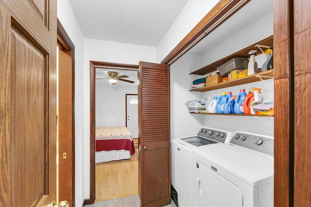 2908 Rolling Acres Dr, Champaign, IL 61822 - laundry room with separate washer and dryer, ceiling fan, light wood-style flooring, and a textured ceiling