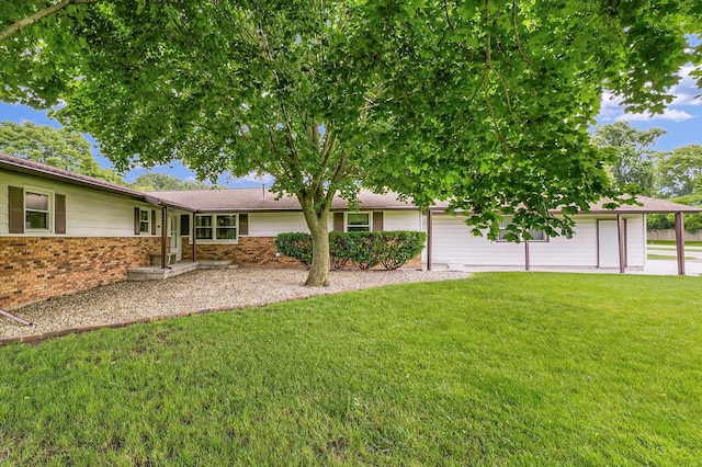 2908 Rolling Acres Dr, Champaign, IL 61822 - view of front facade featuring brick siding and a front yard