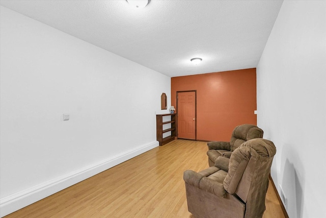 2908 Rolling Acres Dr, Champaign, IL 61822 - sitting room with light wood-type flooring and baseboards
