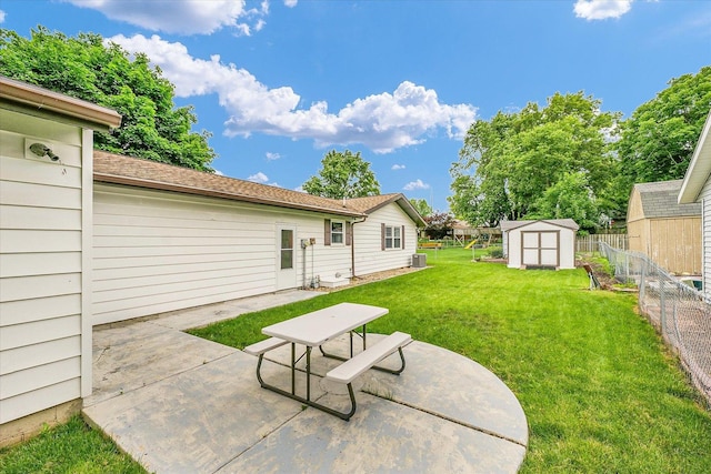 2908 Rolling Acres Dr, Champaign, IL 61822 - fenced backyard with a storage unit and a patio area