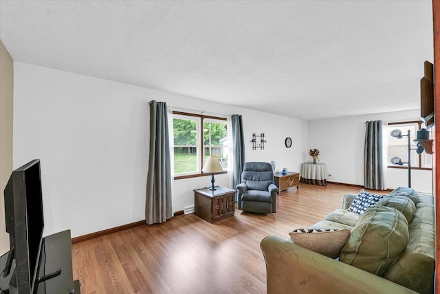 2908 Rolling Acres Dr, Champaign, IL 61822 - living room featuring light wood finished floors and baseboards