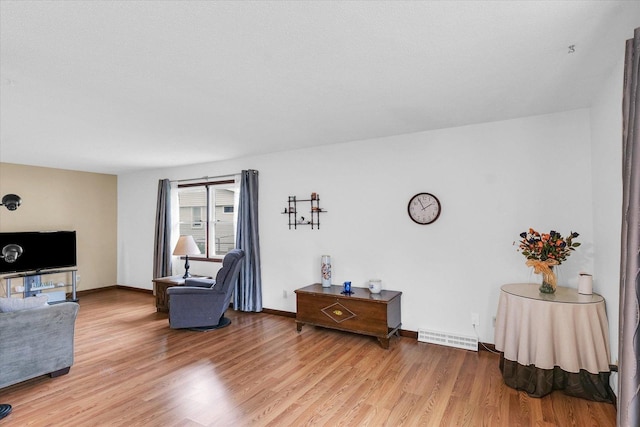 2908 Rolling Acres Dr, Champaign, IL 61822 - living room with light wood-style flooring and baseboards