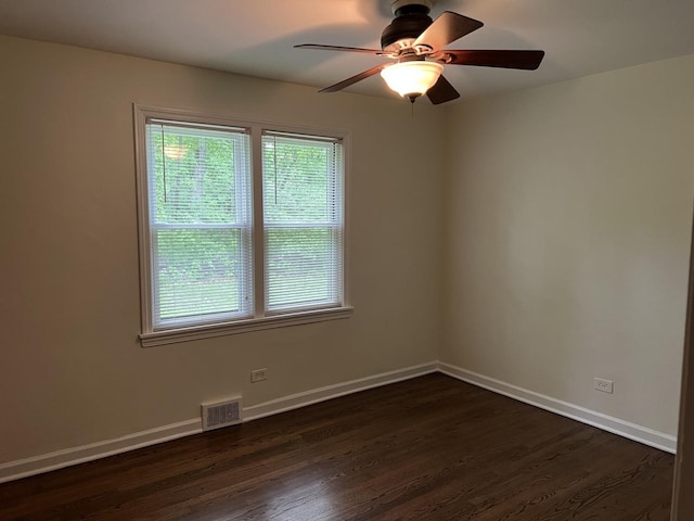 12200 S 88th Ave, Palos Park, IL 60464 - spare room featuring dark wood-style floors, baseboards, and ceiling fan