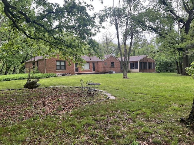 12200 S 88th Ave, Palos Park, IL 60464 - view of grassy yard with a sunroom