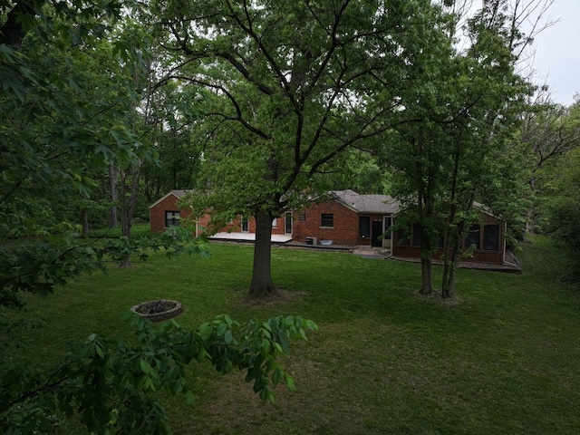 12200 S 88th Ave, Palos Park, IL 60464 - view of green lawn featuring an outdoor fire pit
