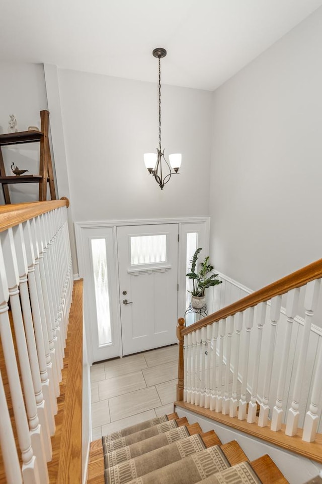1613 Swallow St, Naperville, IL 60565 - foyer entrance with a chandelier, a high ceiling, and stairs