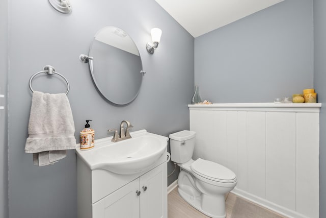 1613 Swallow St, Naperville, IL 60565 - half bathroom featuring vanity, toilet, and baseboards