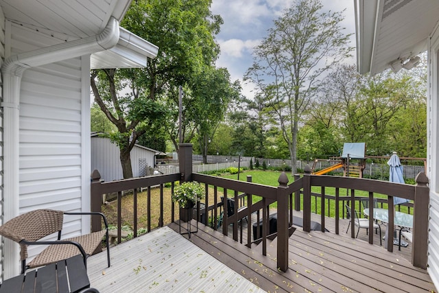 1613 Swallow St, Naperville, IL 60565 - wooden terrace featuring a playground and view of wooded area