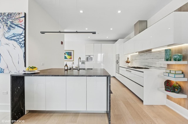 363 E Wacker Dr Unit 1601, Chicago, IL 60601 - kitchen with modern cabinets, white cabinets, a peninsula, light wood-style flooring, and recessed lighting