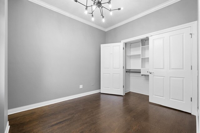 1355 W Washington Blvd Unit 4D, Chicago, IL 60607 - unfurnished bedroom with a chandelier, crown molding, dark wood finished floors, and a closet
