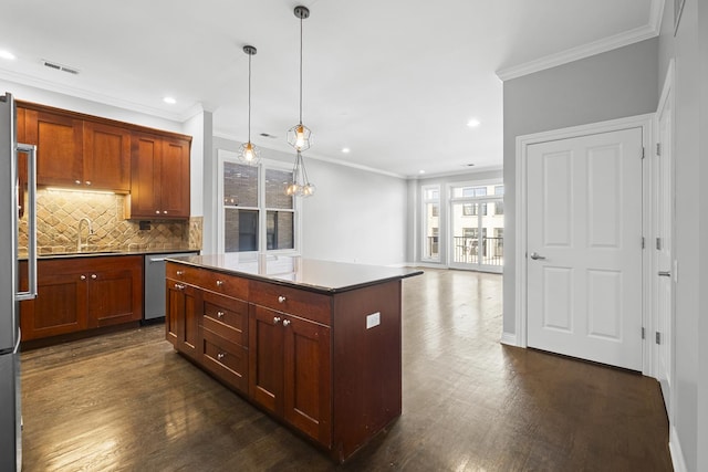 1355 W Washington Blvd Unit 4D, Chicago, IL 60607 - kitchen with appliances with stainless steel finishes, recessed lighting, ornamental molding, decorative backsplash, and dark wood finished floors