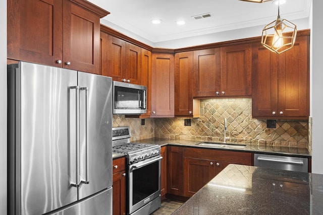 1355 W Washington Blvd Unit 4D, Chicago, IL 60607 - kitchen featuring stainless steel appliances, dark stone counters, crown molding, tasteful backsplash, and pendant lighting