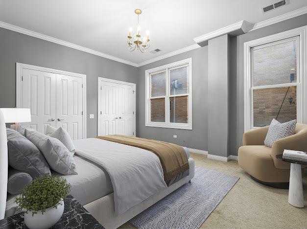 1355 W Washington Blvd Unit 4D, Chicago, IL 60607 - bedroom featuring two closets, a chandelier, light colored carpet, and ornamental molding