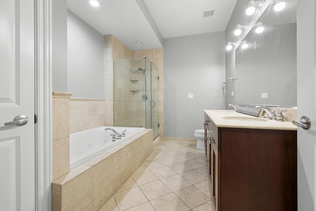1355 W Washington Blvd Unit 4D, Chicago, IL 60607 - full bathroom featuring vanity, a whirlpool tub, a shower stall, and tile patterned floors
