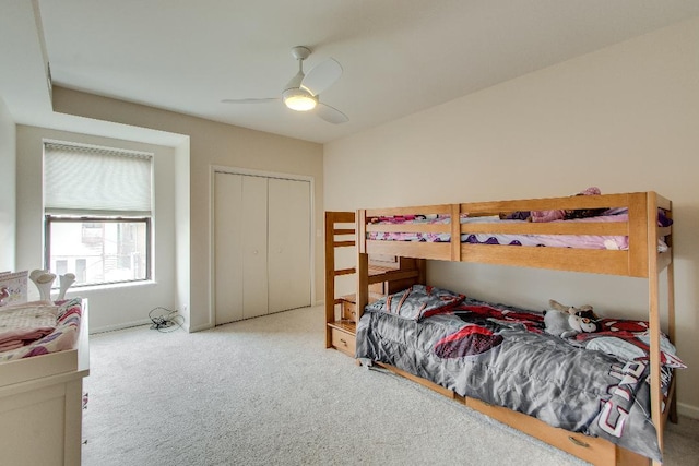 bedroom featuring carpet floors, a closet, and ceiling fan