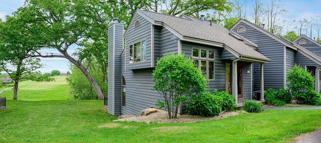 22 Valleywood Ln Unit 22, Galena, IL 61036 - mid-century inspired home with a chimney, a front lawn, and roof with shingles