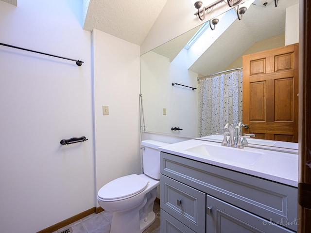 22 Valleywood Ln Unit 22, Galena, IL 61036 - bathroom with tile patterned flooring, toilet, vaulted ceiling, vanity, and a shower with curtain